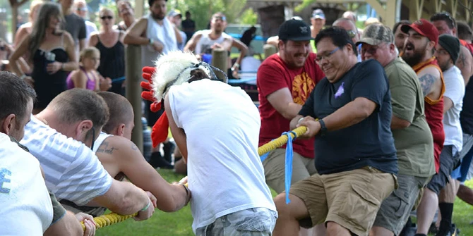 Staff playing tug-of-war.